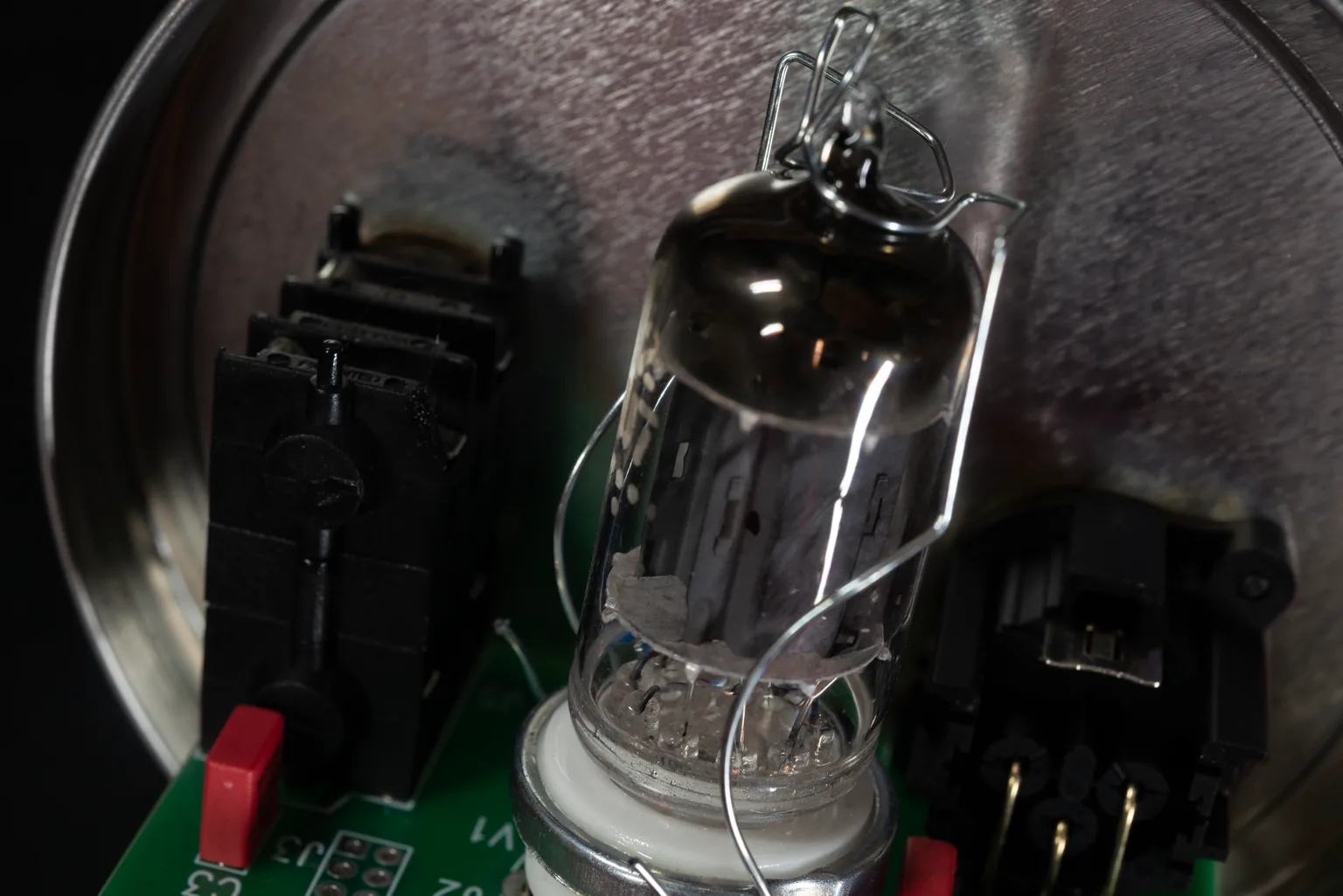 Close-up of the Osetra vacuum tube and circuit board at the assembly bench